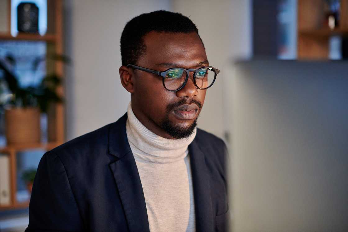 A man looks at the screen A man looks at the screen