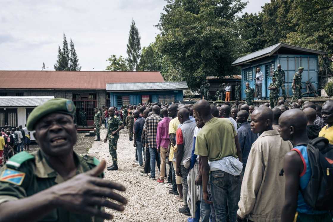 Hundreds of volunteers line up near a military base in Goma for army training Hundreds of volunteers line up near a military base in Goma for army training