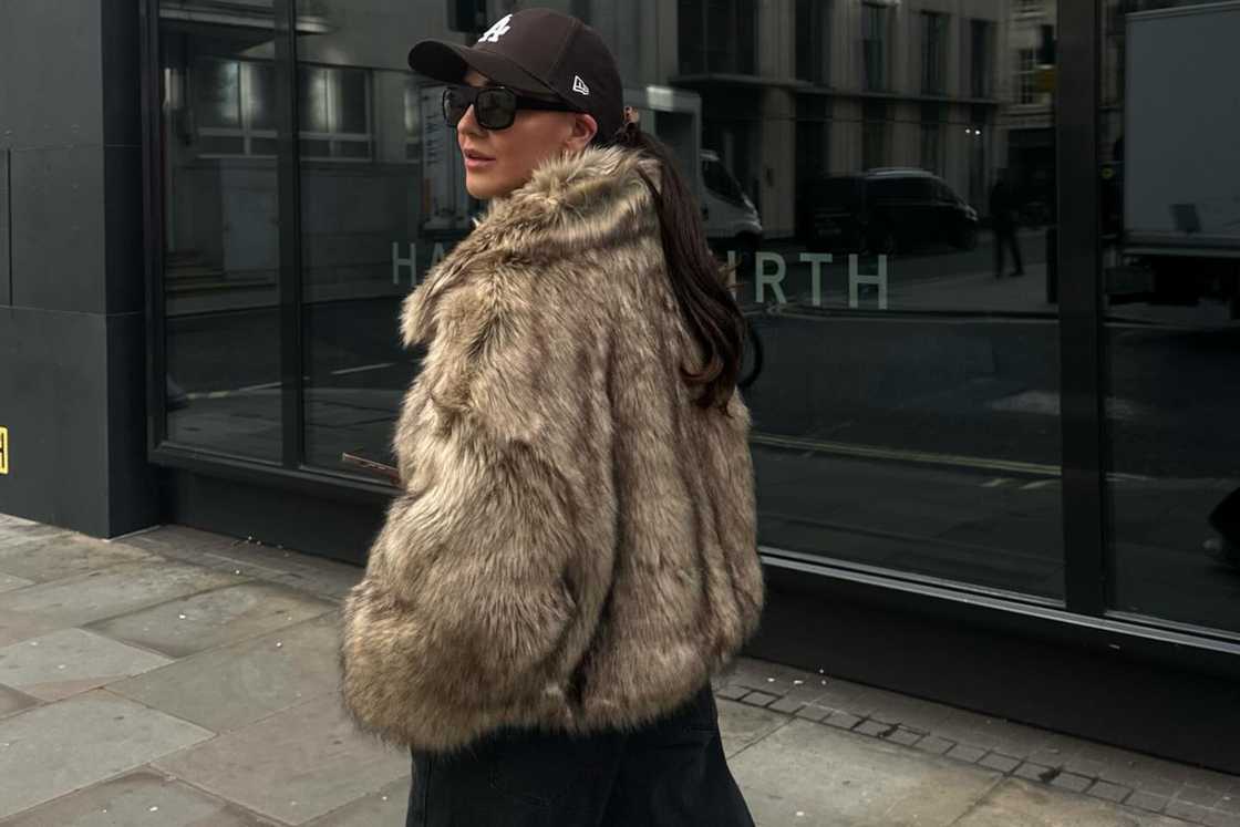 A woman is wearing a fur jacket A woman is wearing a fur jacket