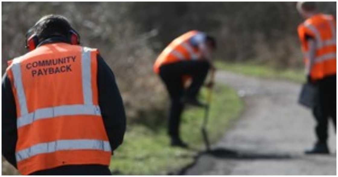 Three men engaged in community service work in the UK