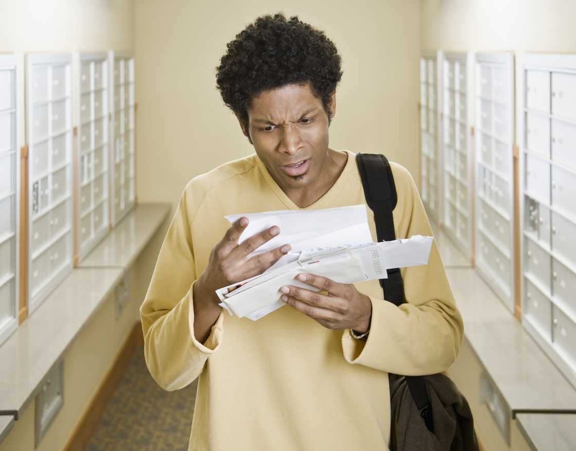 A shocked man reading a document