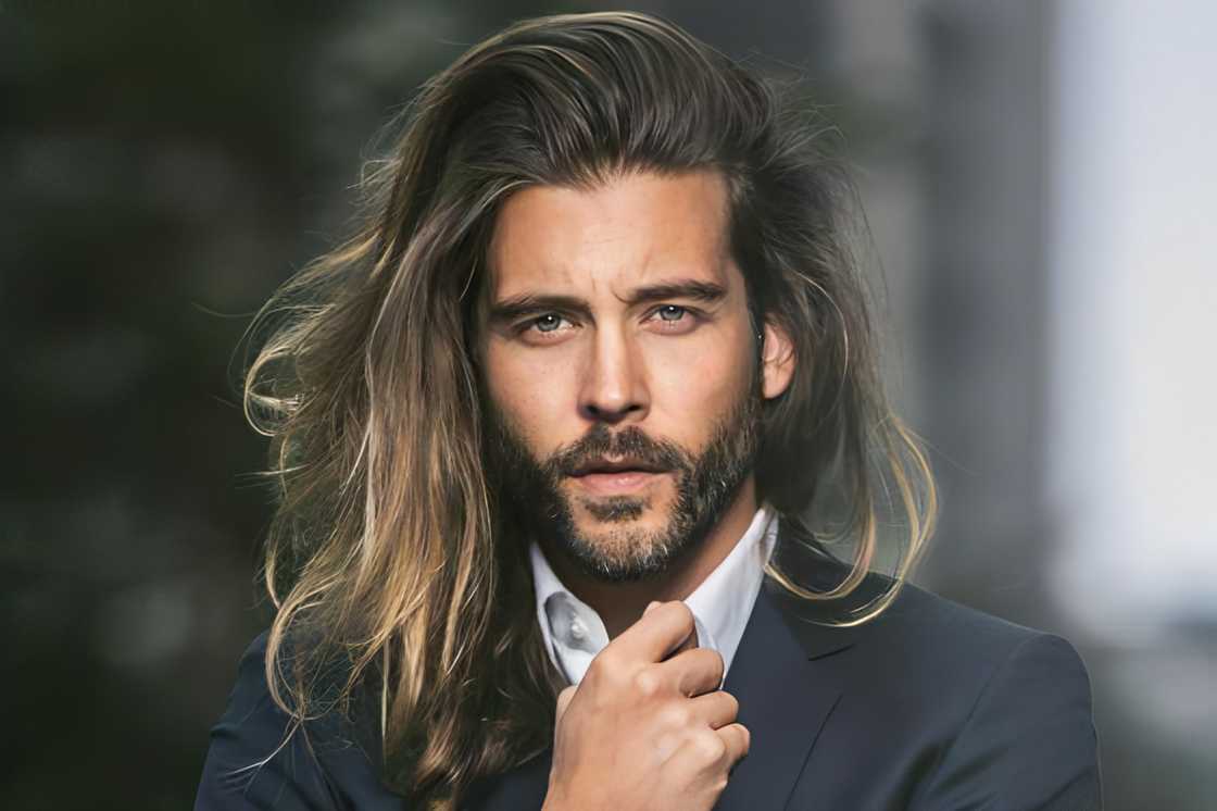 A man rocks a long wavy pompadour hairstyle A man rocks a long wavy pompadour hairstyle