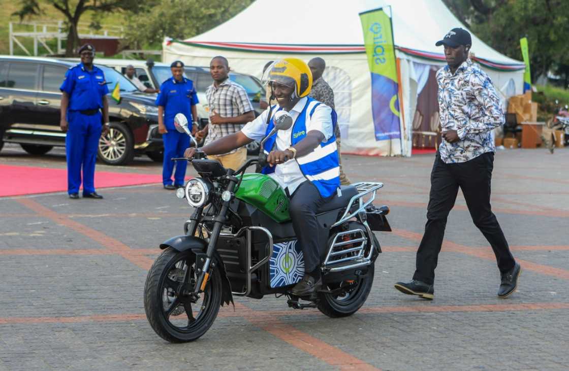 Kenyan President William Ruto takes a ride on one of the new e-bikes Kenyan President William Ruto takes a ride on one of the new e-bikes