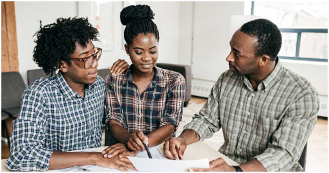 A couple negotiating with a landlord