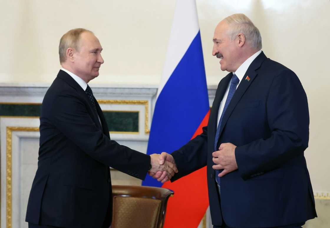 Russian President Vladimir Putin (L) and Belarusian counterpart Alexander Lukashenko at their Saturday meeting in Saint Petersburg