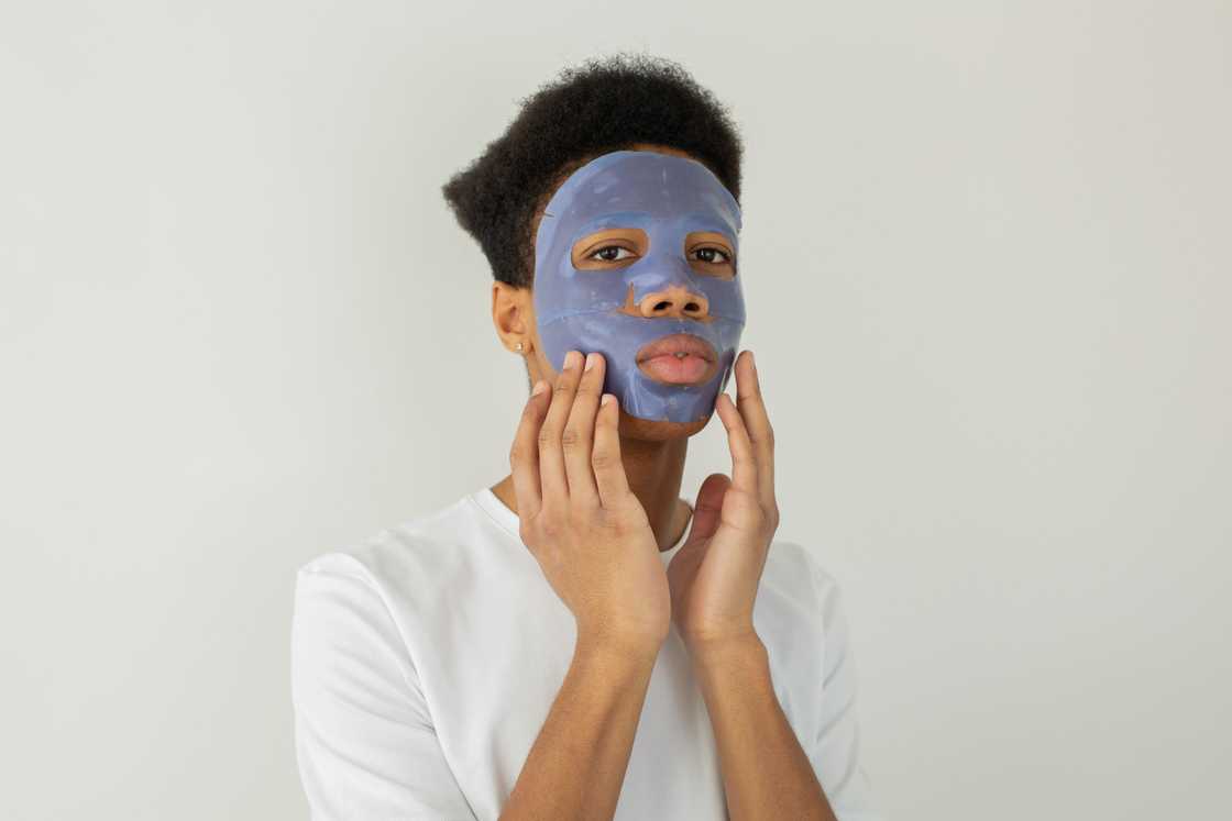 A man in a facial mask