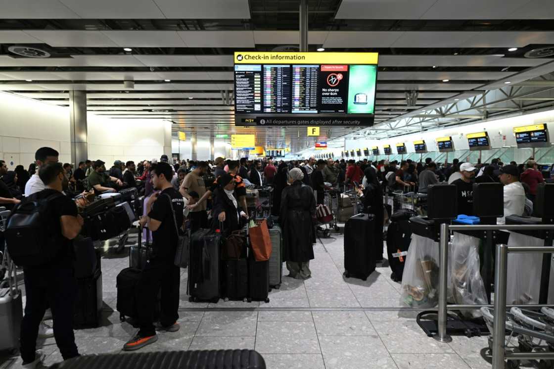 Travellers wait at London's Heathrow Airport, one of the major European airports including Brussels and Berlin hit by a cyberattack Travellers wait at London's Heathrow Airport, one of the major European airports including Brussels and Berlin hit by a cyberattack