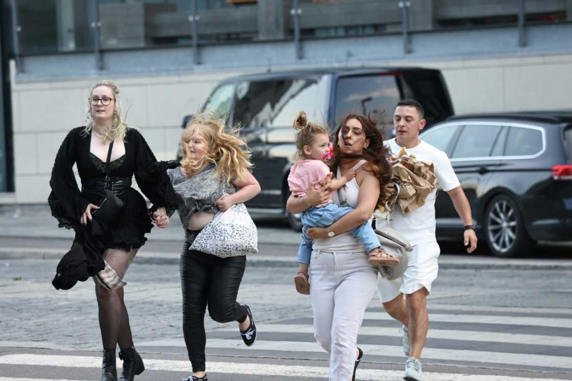 Images from the scene showed parents carrying their children as they fled the building and ambulance personnel carrying people away on stretchers