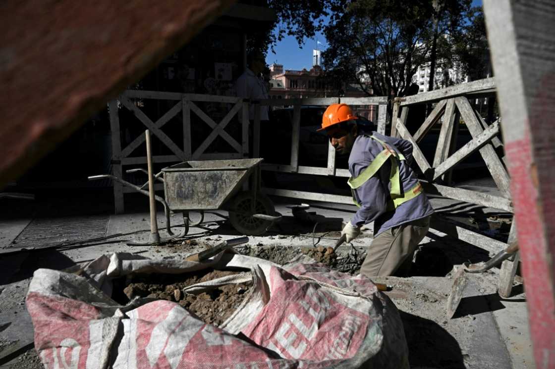 A man works on a street in Buenos Aires, where residents are dealing with soaring inflation. The cost of living in Argentina has risen by 31 percent since January 1. Last year, more than 39 percent of the population was living in poverty A man works on a street in Buenos Aires, where residents are dealing with soaring inflation. The cost of living in Argentina has risen by 31 percent since January 1. Last year, more than 39 percent of the population was living in poverty