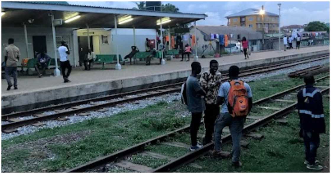 People stand on the railway tracks in Achimota People stand on the railway tracks in Achimota
