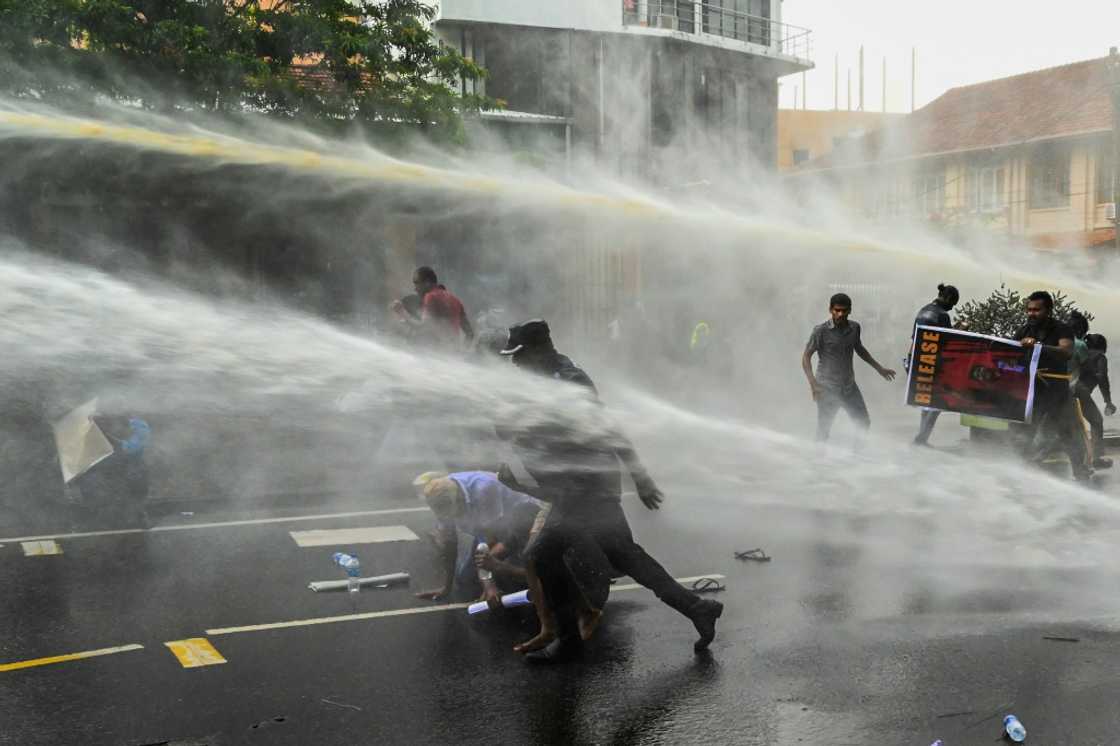 Police use water cannon to disperse demonstrators in Colombo on Tuesday Police use water cannon to disperse demonstrators in Colombo on Tuesday