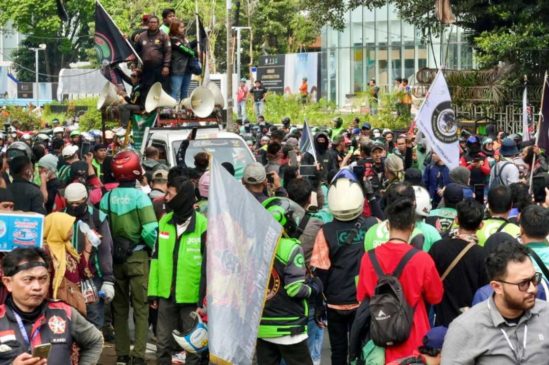 Drivers who form the backbone of Indonesia's sprawling gig economy earn up to 150,000 rupiah ($10) a day Drivers who form the backbone of Indonesia's sprawling gig economy earn up to 150,000 rupiah ($10) a day