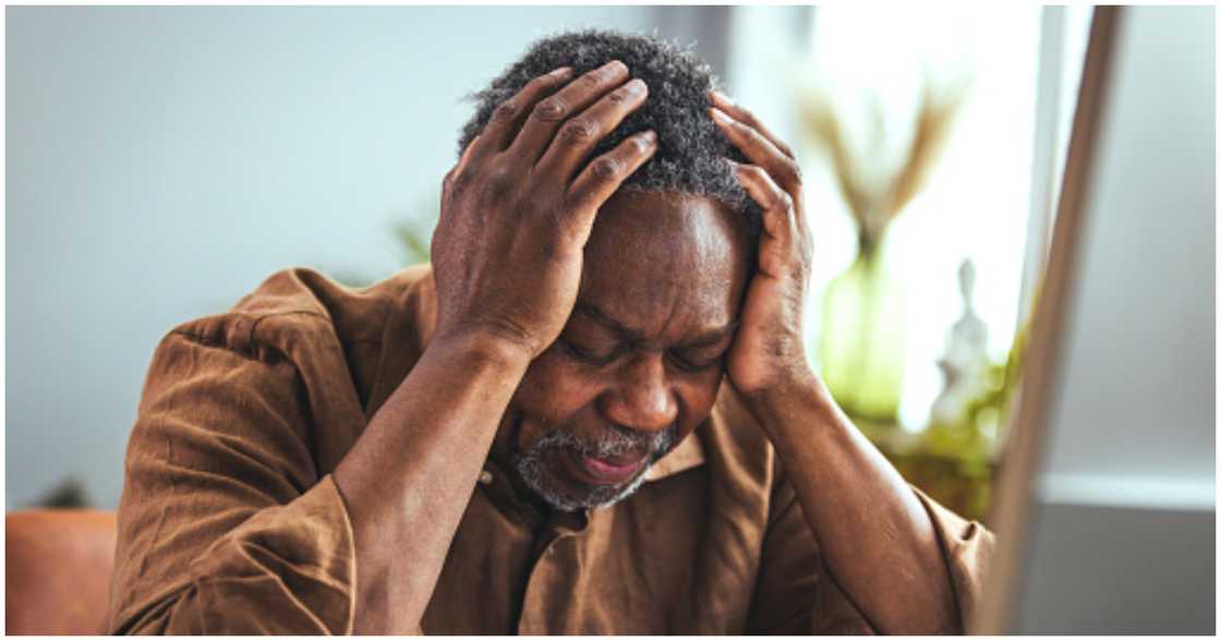 Photo of a man looking sad Photo of a man looking sad