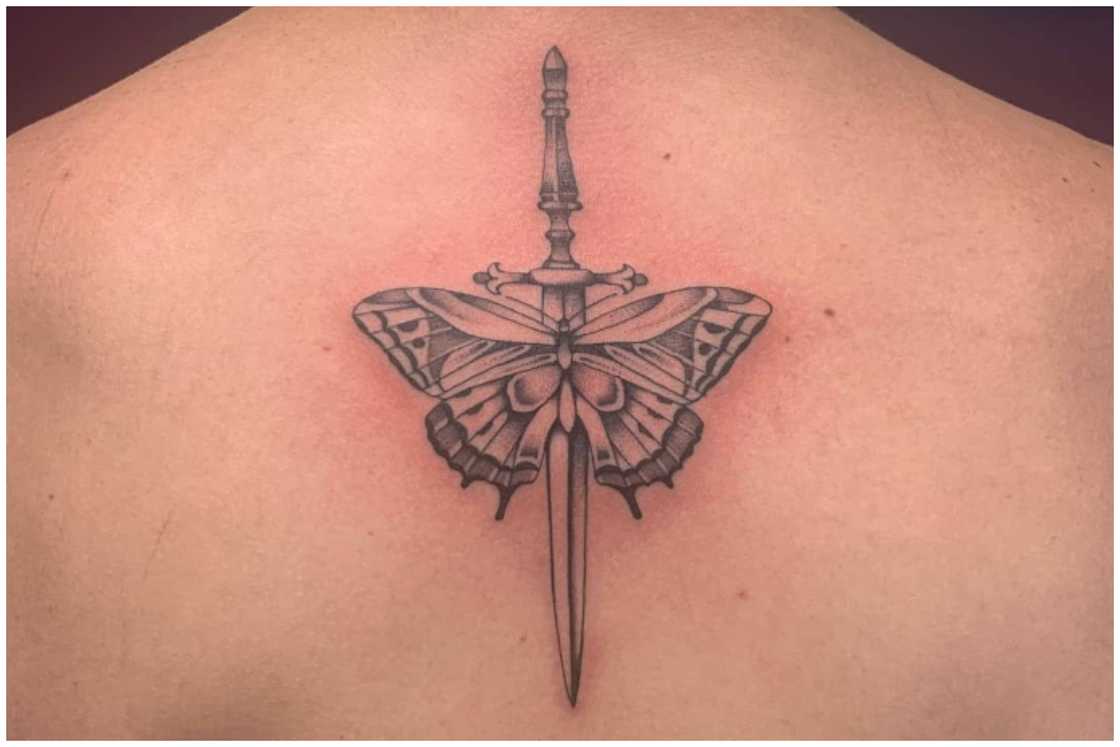 Dagger and butterfly tattoo