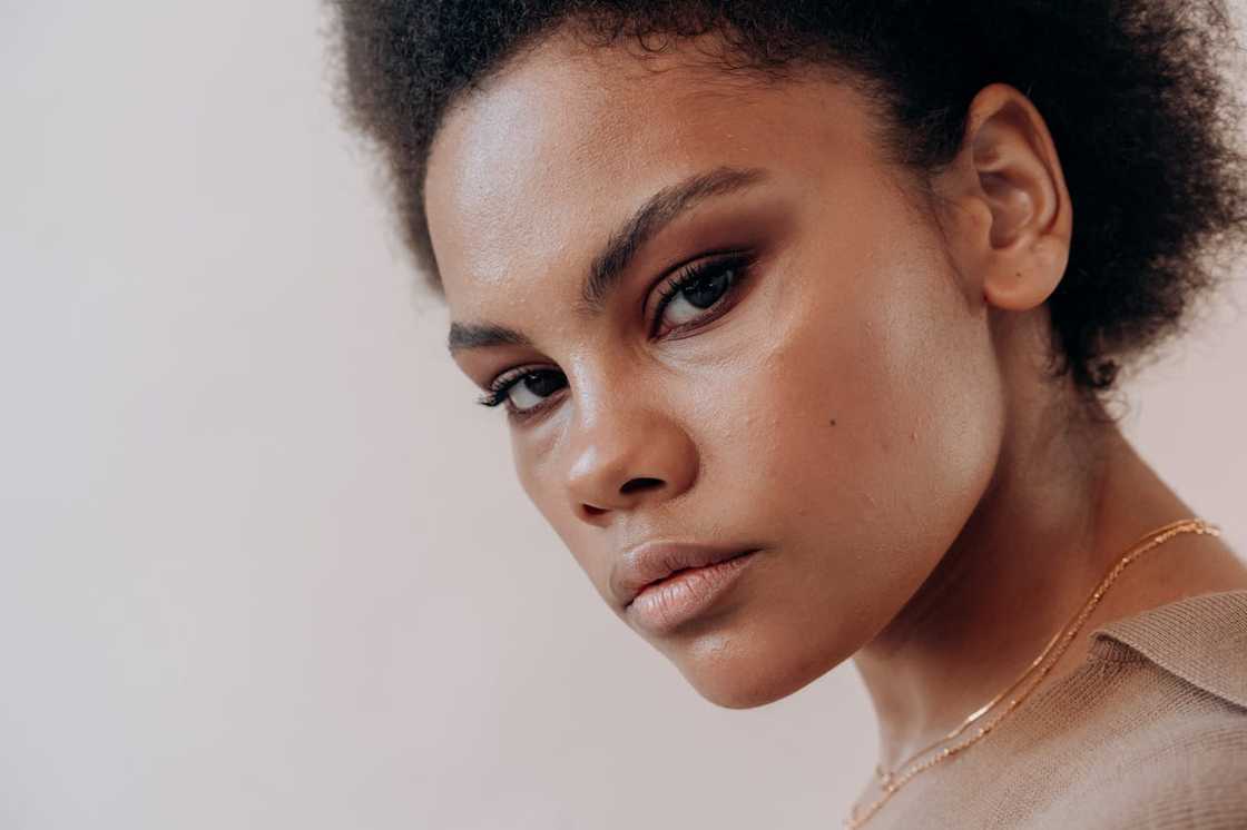 A woman with an expressionless face. A woman with an expressionless face.