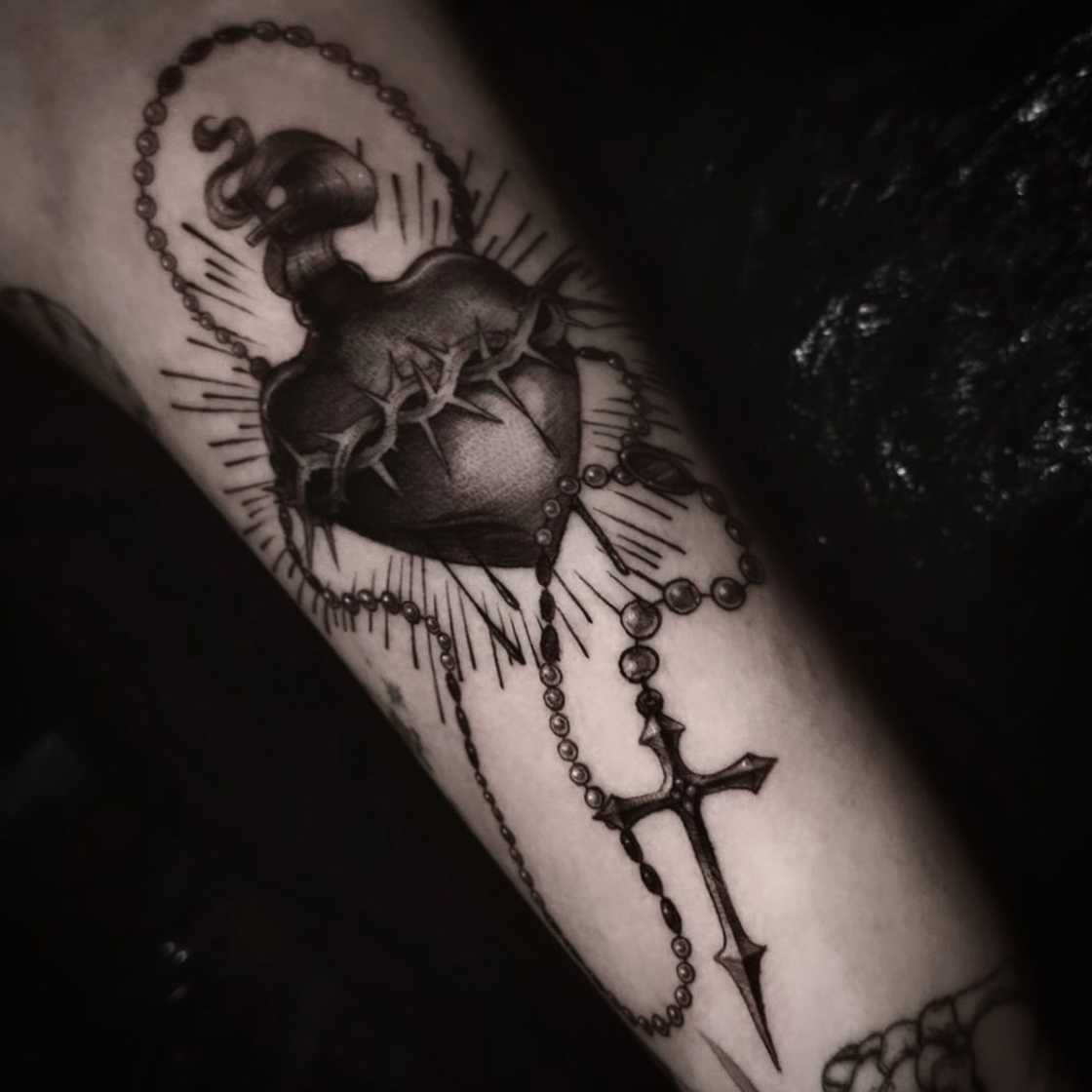 Custom inner bicep sacred heart and rosary tattoo