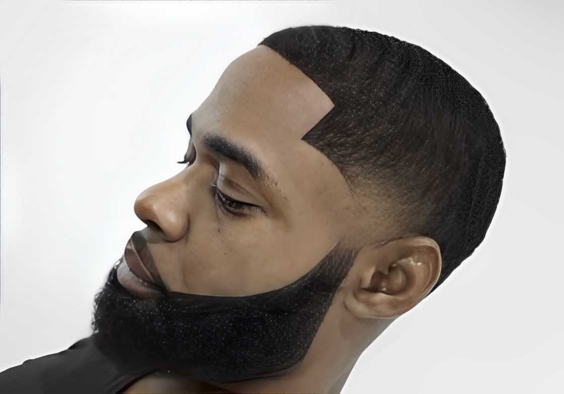 A black man with a temp fade and beard style A black man with a temp fade and beard style