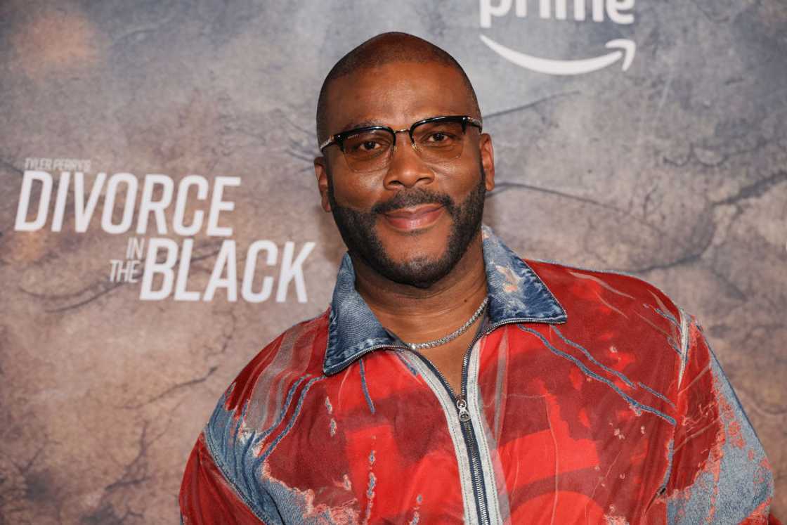 Tyler Perry in a red and blue jacket