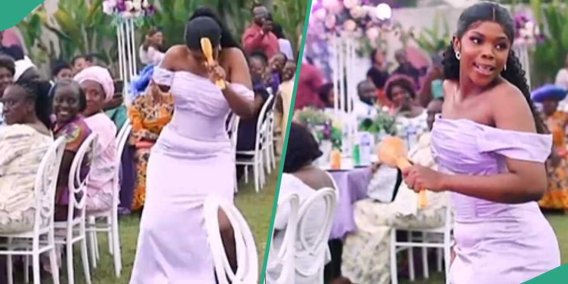 A bridesmaid wears a purple dress at a wedding