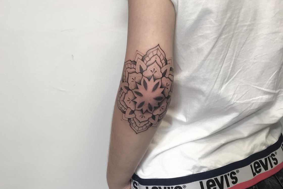 Black and grey mandala elbow tattoo Black and grey mandala elbow tattoo