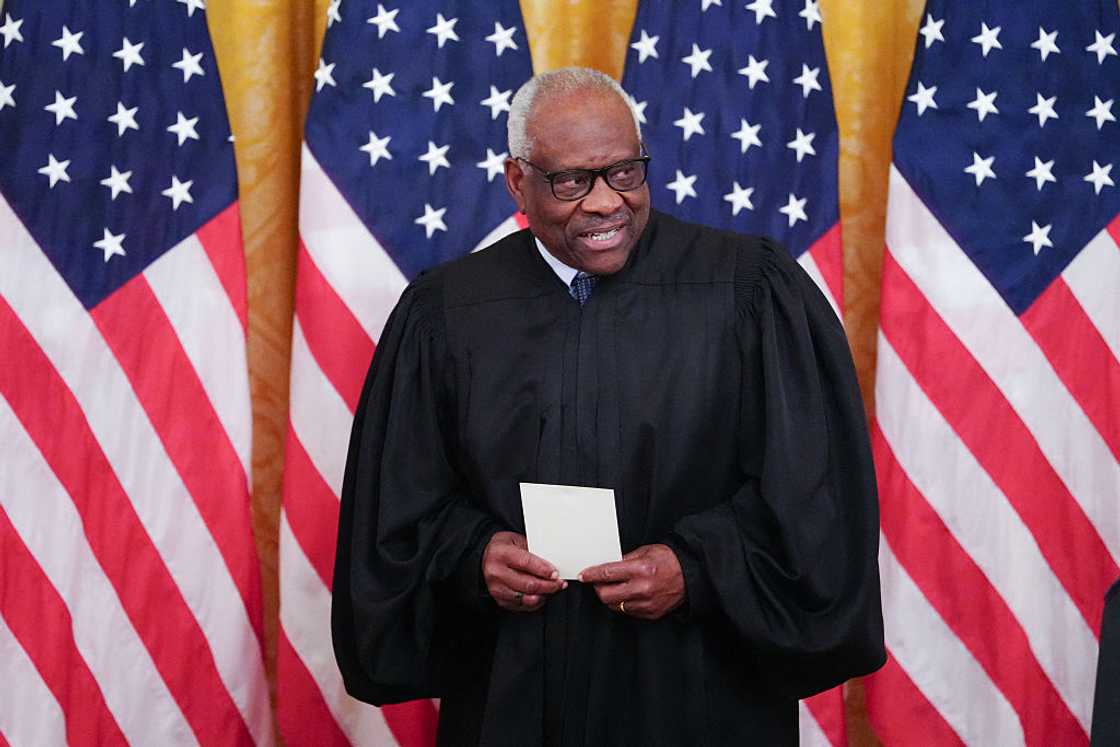 Supreme Court Justice Clarence Thomas looks on during a swearing in ceremony for new Chairman of the Federal Reserve Kevin Warsh Supreme Court Justice Clarence Thomas looks on during a swearing in ceremony for new Chairman of the Federal Reserve Kevin Warsh