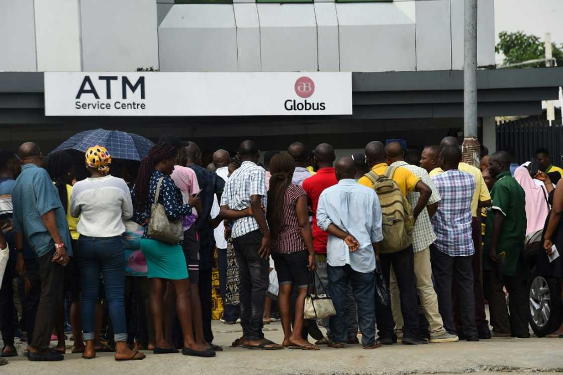 The naira currency exchange has caused cash shortages and queues outside ATMs and banks The naira currency exchange has caused cash shortages and queues outside ATMs and banks