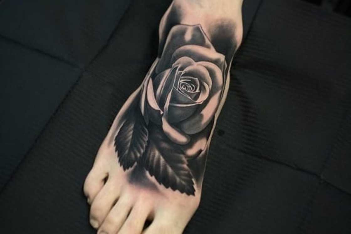 A striking rose on the foot tattoo A striking rose on the foot tattoo
