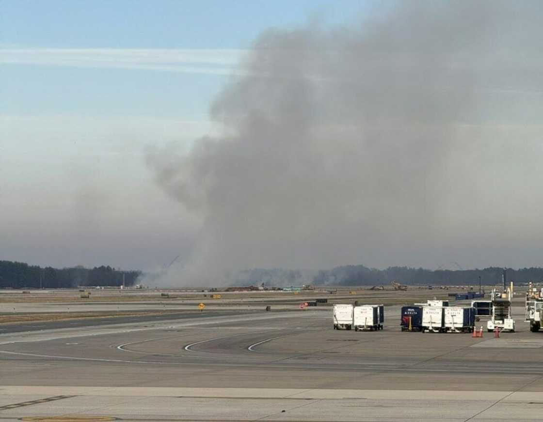 Brush burns near a runway at Dulles Airport outside Washington after a plane experienced engine failure during takeoff Brush burns near a runway at Dulles Airport outside Washington after a plane experienced engine failure during takeoff