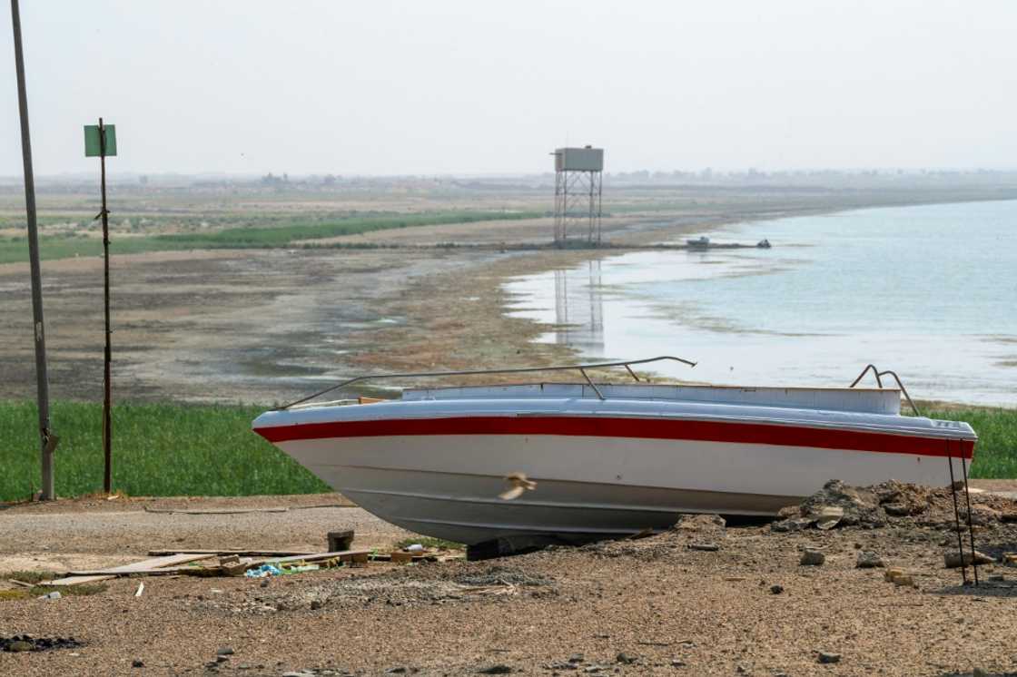A boat is grounded by the receding shoreline of Iraq's Lake Habbaniyah, affected by a severe four-year drought A boat is grounded by the receding shoreline of Iraq's Lake Habbaniyah, affected by a severe four-year drought