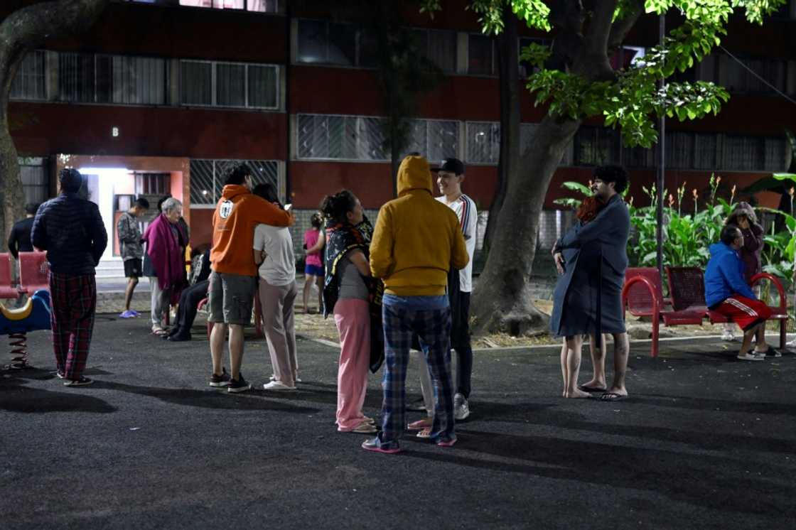 People wait in the streets of Mexico City after a strong earthquake hit overnight People wait in the streets of Mexico City after a strong earthquake hit overnight