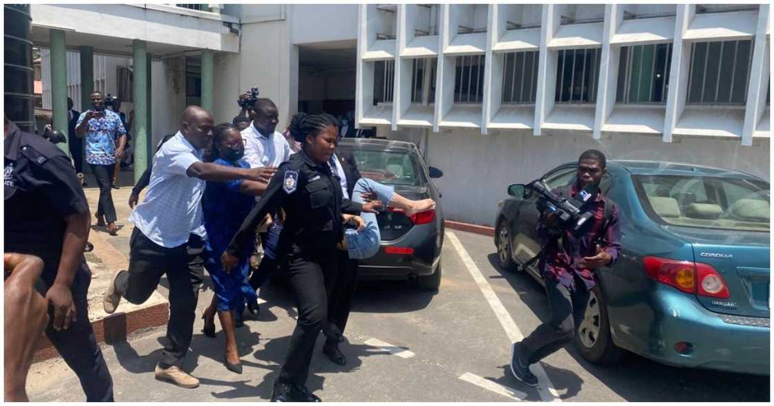 The accused person was quickly rushed into a waiting vehicle The accused person was quickly rushed into a waiting vehicle