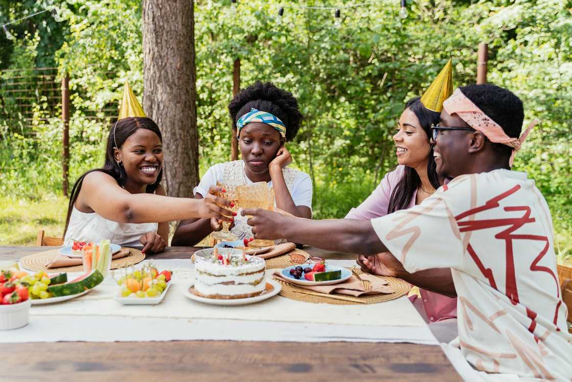 A woman with a bored expression while others enjoy the party.
