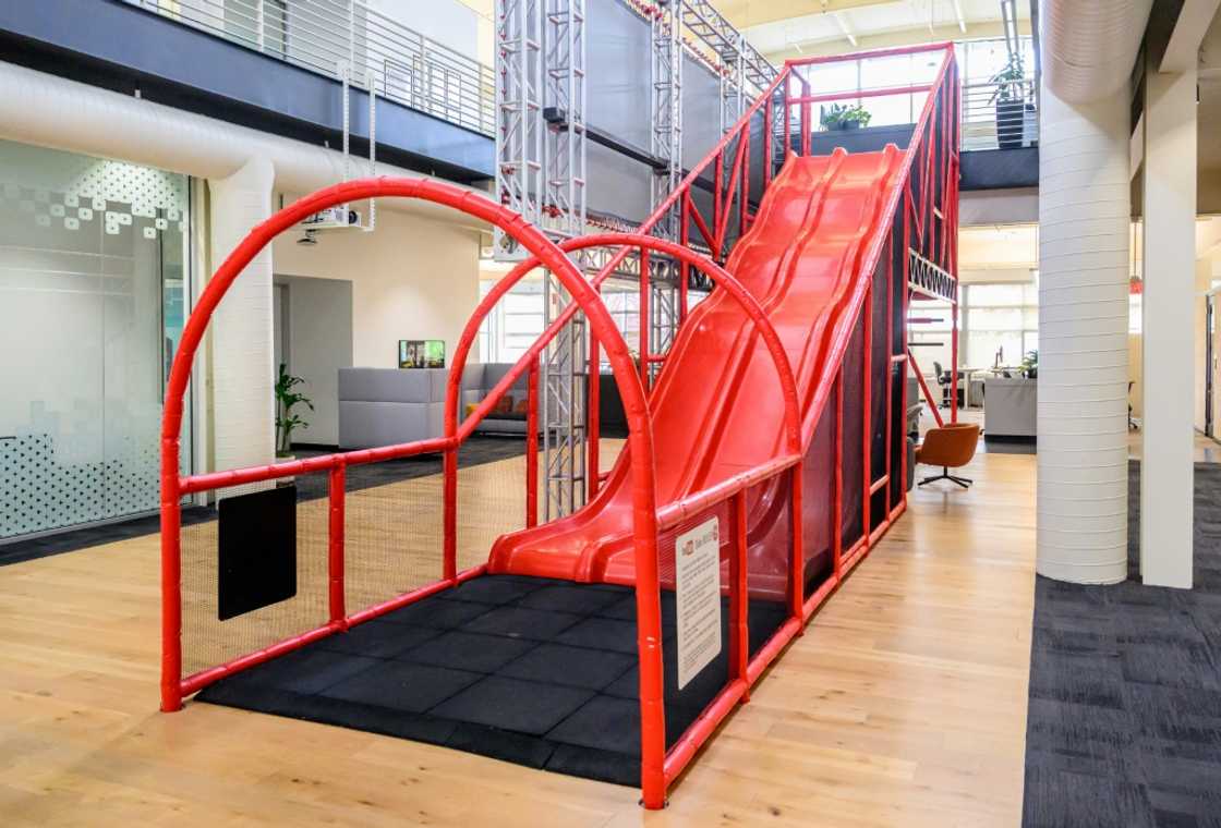 A slide that employees use to zip down to the first a floor inside YouTube's headquarters in San Bruno, California, harkens back to playful early days at the online video sharing platform now challenging traditional television