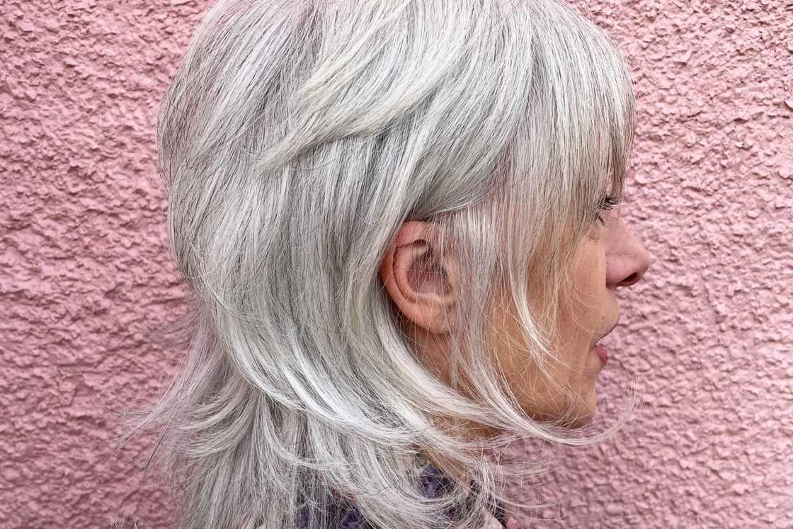 An over 60 year old is rocking a wispy bob hairstyle An over 60 year old is rocking a wispy bob hairstyle