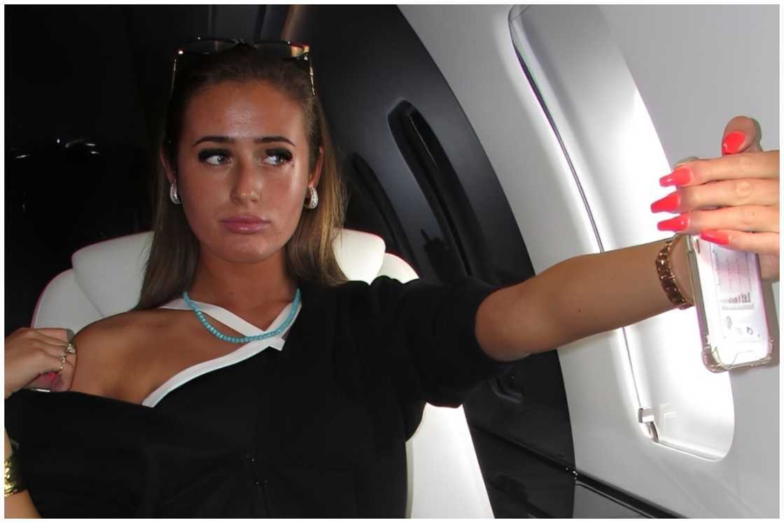 Venezuela pose for a picture inside a plane.