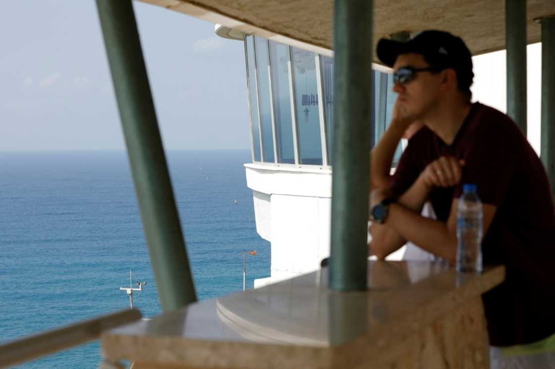A man looks out to sea towards maritime border markers in Mediterranean waters off Israel's crossing at Rosh Hanikra, known in Lebanon as Ras al-Naqura A man looks out to sea towards maritime border markers in Mediterranean waters off Israel's crossing at Rosh Hanikra, known in Lebanon as Ras al-Naqura