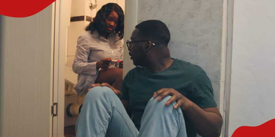 Photo of young African couple looking at the result of a pregnancy test. Photo of young African couple looking at the result of a pregnancy test.