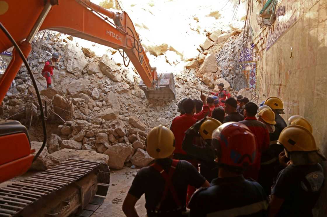 Rescuers used a backhoe and bulldozer to search the rubble for victims at Qattarat al-Imam Ali shrine in Karbala, Iraq Rescuers used a backhoe and bulldozer to search the rubble for victims at Qattarat al-Imam Ali shrine in Karbala, Iraq