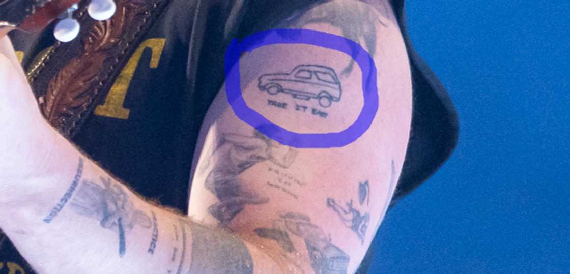 Zach Bryan's car tattoo on his bicep