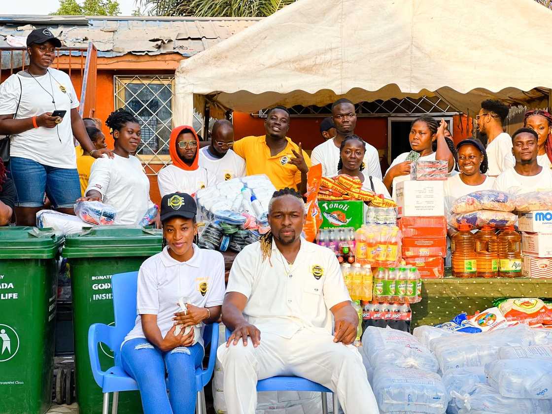 Ghanaian business man Godfada Gh Houston and his team at Save Them Young Orphanage.