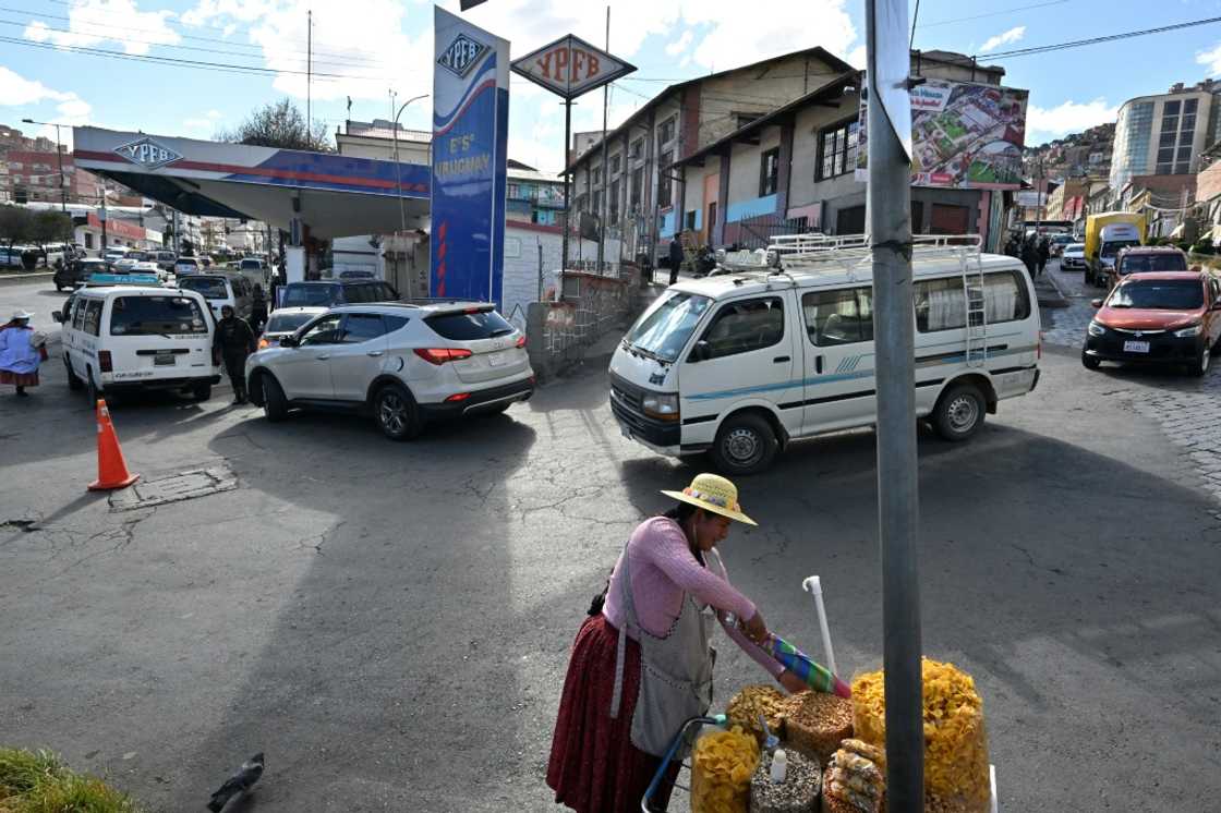 Long lines for fuel at petrol stations have become a defining image of Bolivia's worst economic crisis in a generation Long lines for fuel at petrol stations have become a defining image of Bolivia's worst economic crisis in a generation