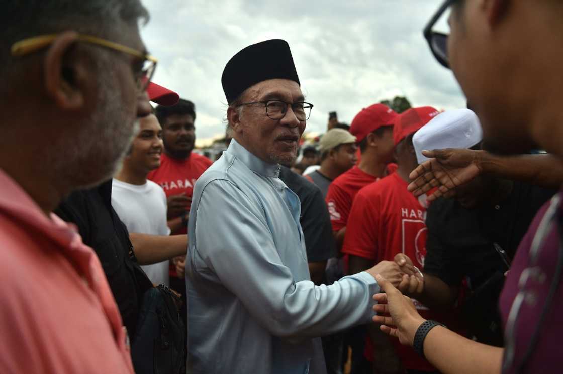 With age catching up, this election could be Anwar Ibrahim's (C) last chance to fulfil a 20-year dream to lead Southeast Asia's third-largest economy