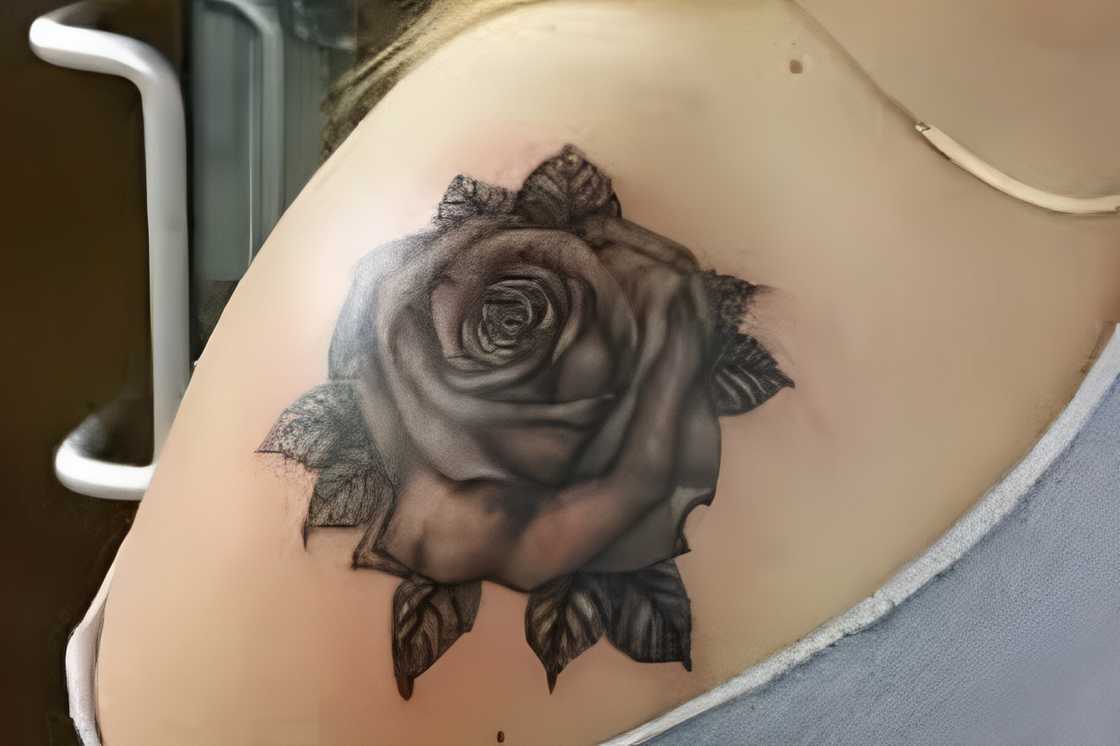 A black and grey front shoulder tattoo A black and grey front shoulder tattoo