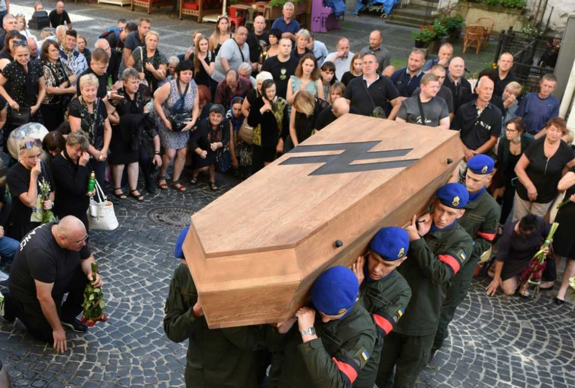 Ukrainian soldiers carry the coffin of Vasyl Sushchuk, an Azov regiment serviceman killed during fighting with Russian troops Ukrainian soldiers carry the coffin of Vasyl Sushchuk, an Azov regiment serviceman killed during fighting with Russian troops