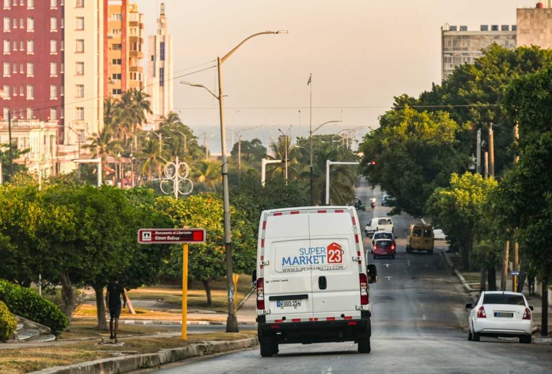 A delivery van from a US-based food remittance company drives on a street in Havana on May 22, 2024 A delivery van from a US-based food remittance company drives on a street in Havana on May 22, 2024