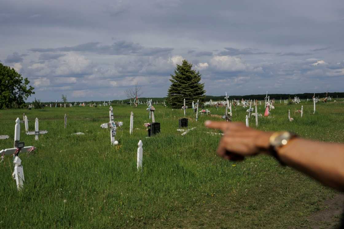Eric Large, former Saddle Lake First Nation chief and onetime student at the Blue Quills Indian Residential School, points to where unmarked graves have been found in Saddle Lake Cemetery on Saddle Lake Cree Nation in Alberta, Canada Eric Large, former Saddle Lake First Nation chief and onetime student at the Blue Quills Indian Residential School, points to where unmarked graves have been found in Saddle Lake Cemetery on Saddle Lake Cree Nation in Alberta, Canada