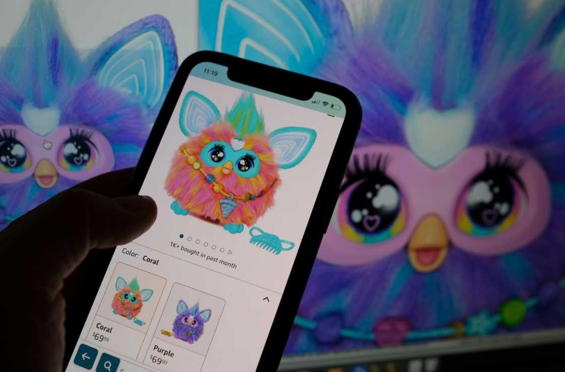 This illustration photo shows a smartphone screen with the recently relaunched Furby toy now on sale