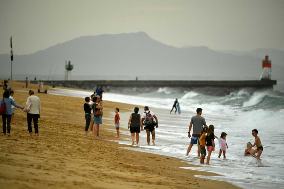 Warm October weather has seen many flock to the beach -- such as here at Hossegor, southwestern France -- but environmentalists see more evidence of climate change Warm October weather has seen many flock to the beach -- such as here at Hossegor, southwestern France -- but environmentalists see more evidence of climate change