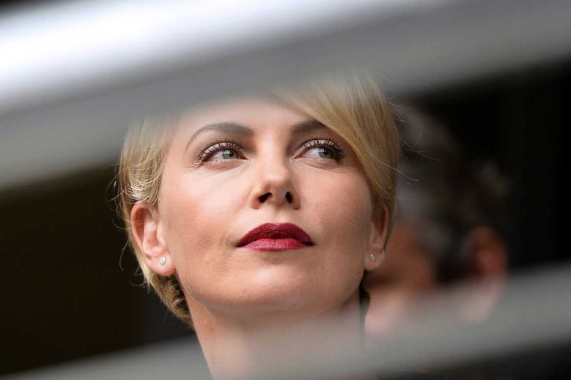 Language storm: Charlize Theron, pictured here at the funeral of Nelson Mandela in December 2013 Language storm: Charlize Theron, pictured here at the funeral of Nelson Mandela in December 2013