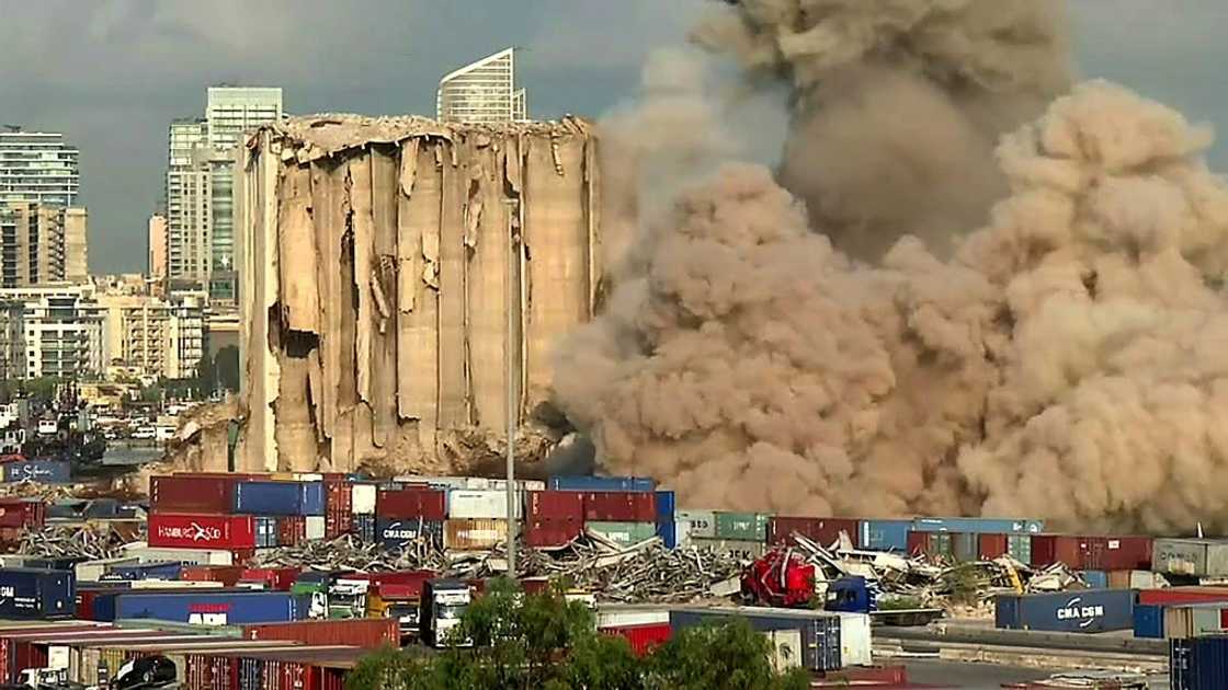 This grab from AFPTV footage shows a massive plume of smoke rising over Beirut port after the collapse of eight more grain silos damaged in a devastating 2020 explosion This grab from AFPTV footage shows a massive plume of smoke rising over Beirut port after the collapse of eight more grain silos damaged in a devastating 2020 explosion